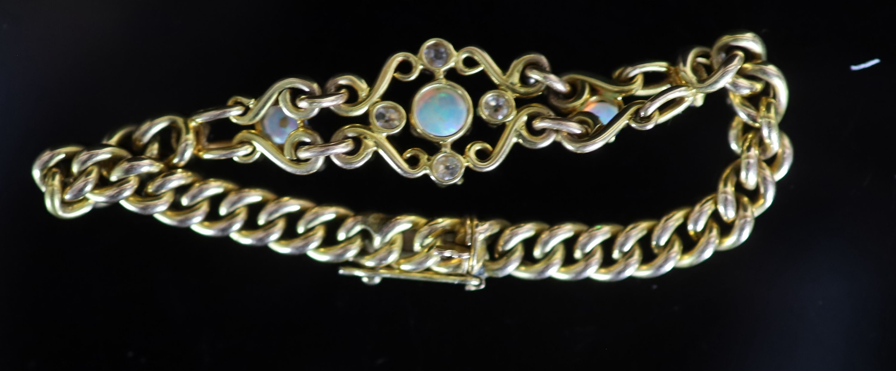 An early 20th century 15ct gold white opal and diamond set curblink bracelet